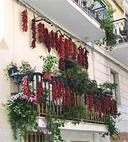 Chiles drying on a balcony