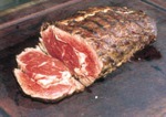 The cooked rib eye being sliced
