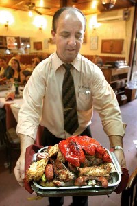 A waiter holding a typical